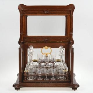 Appraisal: Napoleon III glass paneled walnut tantalus th th c with