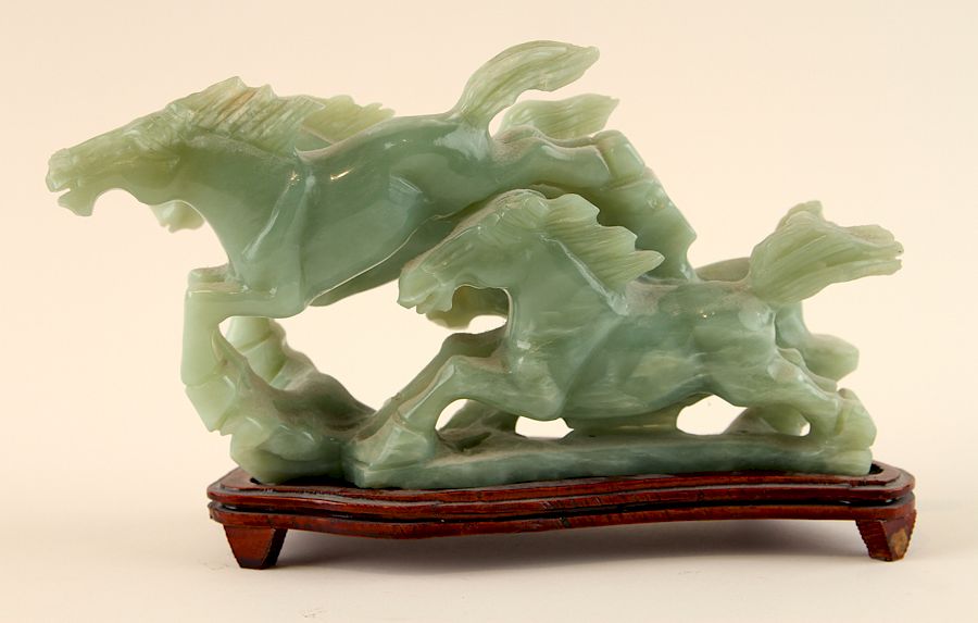 Appraisal: JADEITE SCULPURE OF HORSE FIGURAL GROUP A jadeite sculpture of