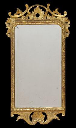 Appraisal: GEORGE II CARVED GILTWOOD MIRROR The beveled plate within narrow