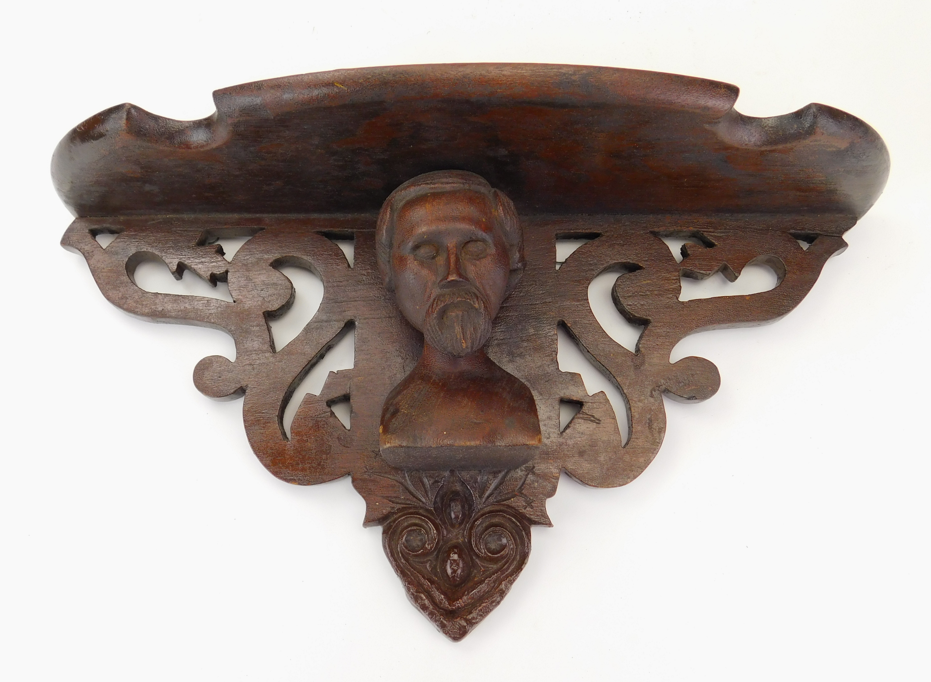 Appraisal: Victorian carved wood clock shelf with central carved bust repair