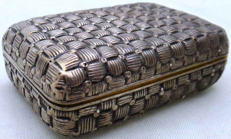 Appraisal: A silver rectangular hinge lidded snuff box gilt within the