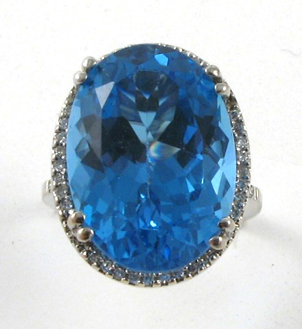 Appraisal: BLUE TOPAZ AND DIAMOND RING k white gold centering an