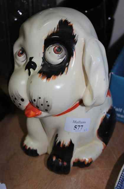 Appraisal: A CROWN DEVON POTTERY DOG with puppy eyes high together