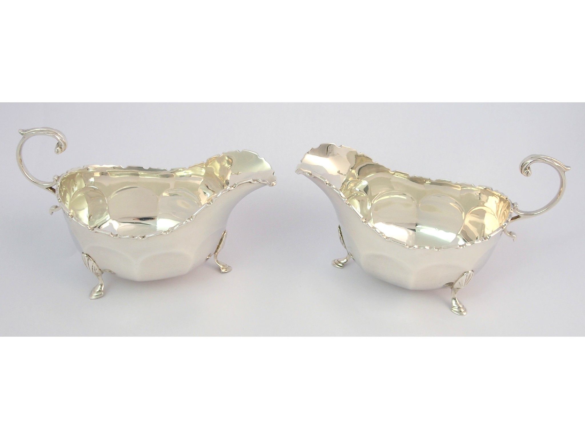 Appraisal: A pair of silver sauce boatsby Adie Brothers Limited Birmingham