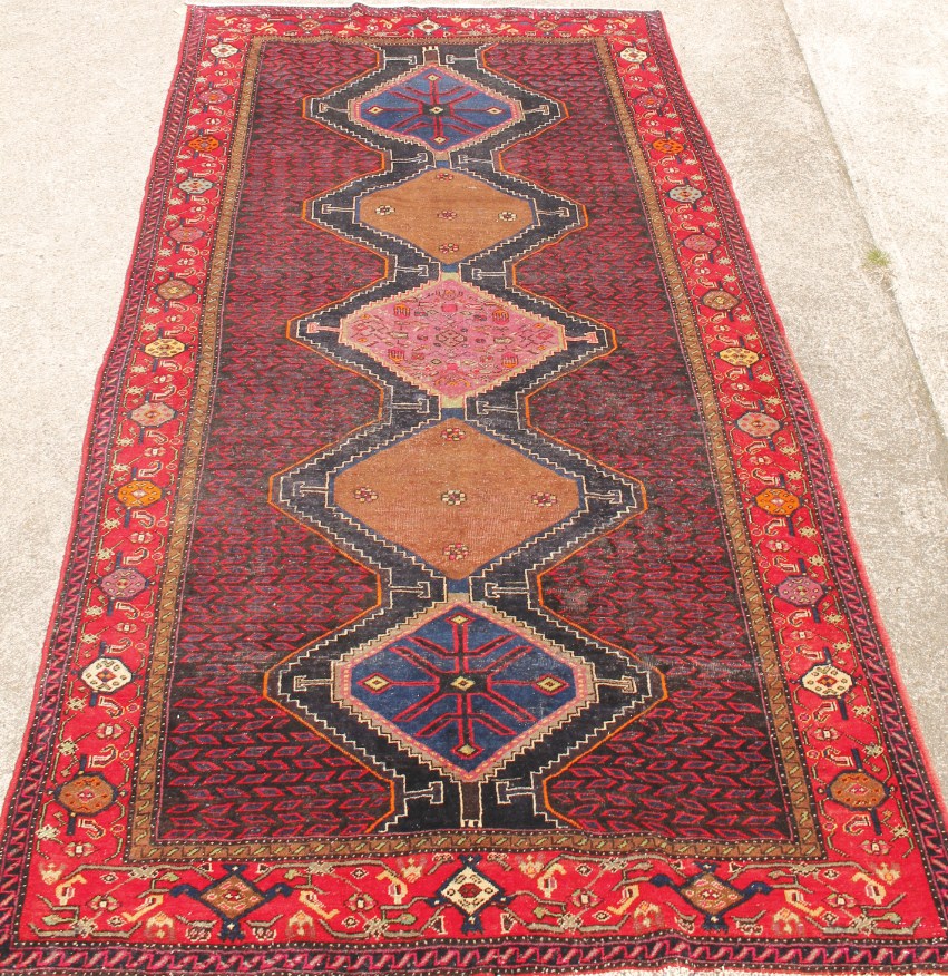 Appraisal: A Lori runner in medallion blue and red cm x