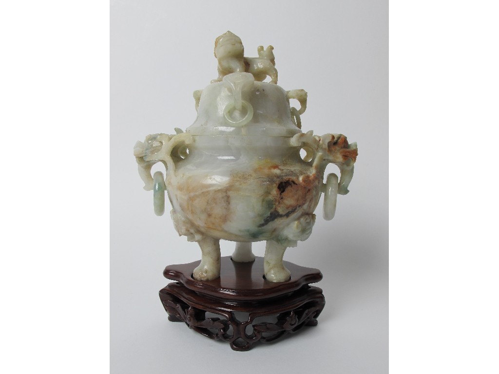 Appraisal: A Chinese jadeite incense burner and cover carved with animal