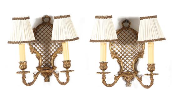 Appraisal: Pair gilt-bronze two-light wall sconces with pierced backplate H W