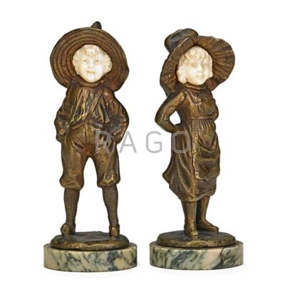 Appraisal: TWO CONTINENTAL FIGURAL BRONZES Boy and girl with ivory faces