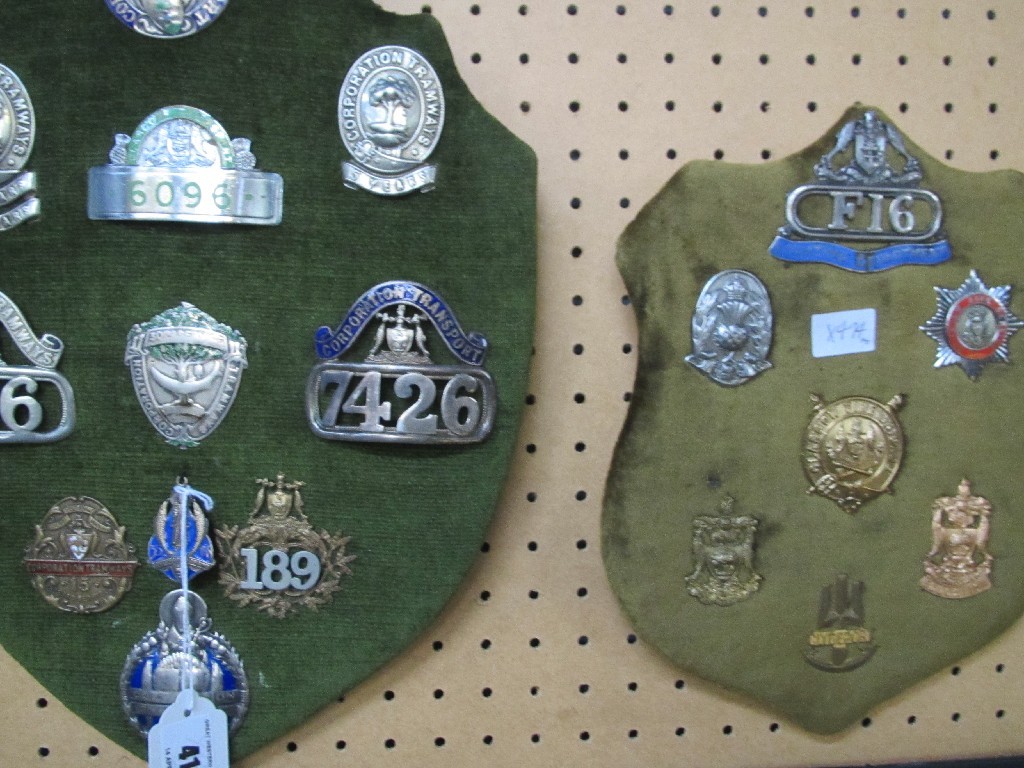 Appraisal: Lot comprising two shield shaped plaques with assorted transport badges