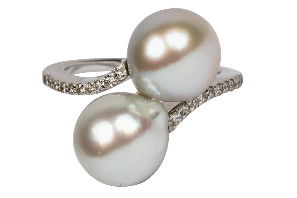 Appraisal: KARAT WHITE GOLD DIAMOND PEARL BYPASS RINGcontaining two semi-spherical half-drilled