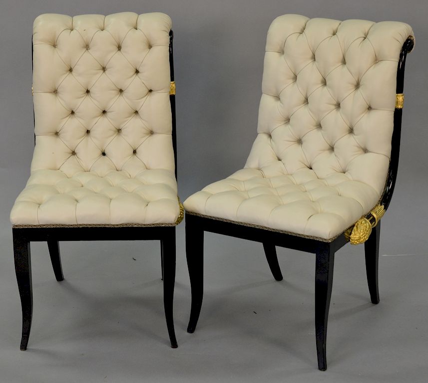 Appraisal: Pair of French style black and gilt chairs with white