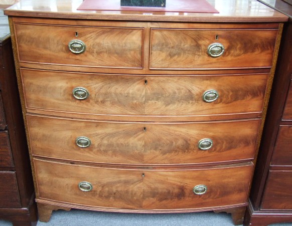 Appraisal: A Regency mahogany bowfront chest of two short and three