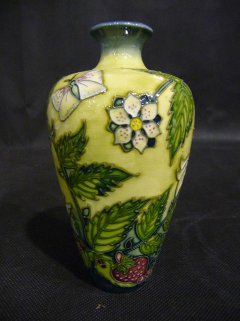 Appraisal: A shouldered ovoid form vase with everted rim designed with