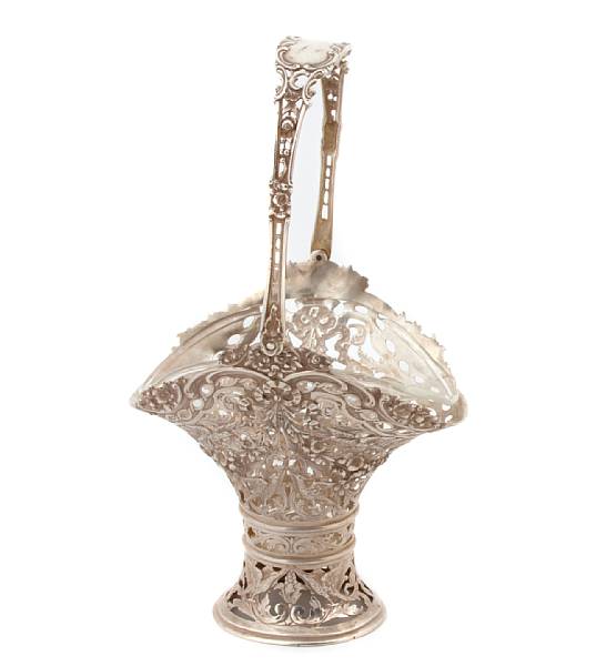 Appraisal: A German standard silver reticulated basket form vase with glass