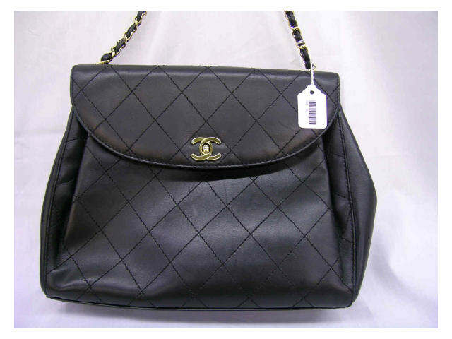 Appraisal: Chanel handbag quilted black leather with toggle clasp with flap