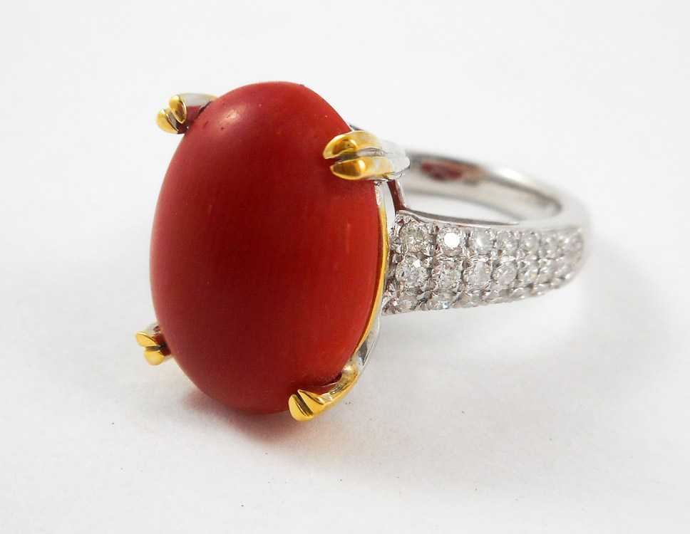 Appraisal: CORAL DIAMOND AND FOURTEEN KARAT GOLD RING The white and