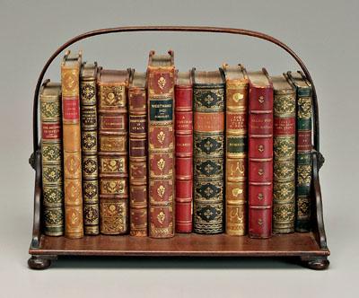 Appraisal: leather-bound books in wooden book caddy - x x -