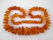 Appraisal: An amber necklace largest piece approx cm necklace approx cm