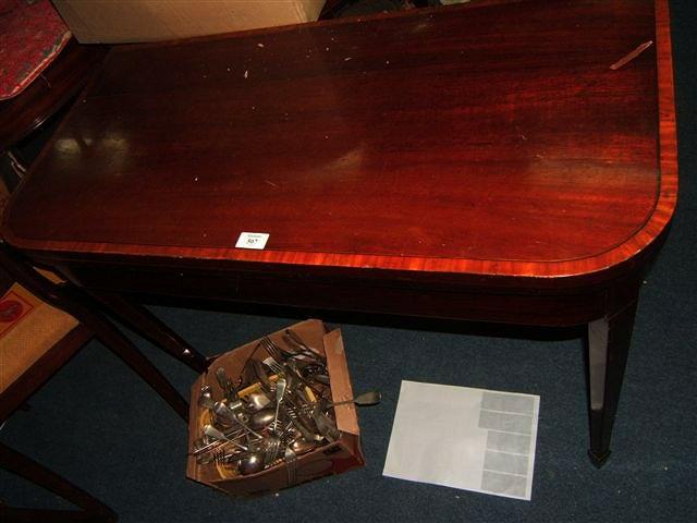 Appraisal: A Georgian mahogany and satinwood inlaid fold over card table