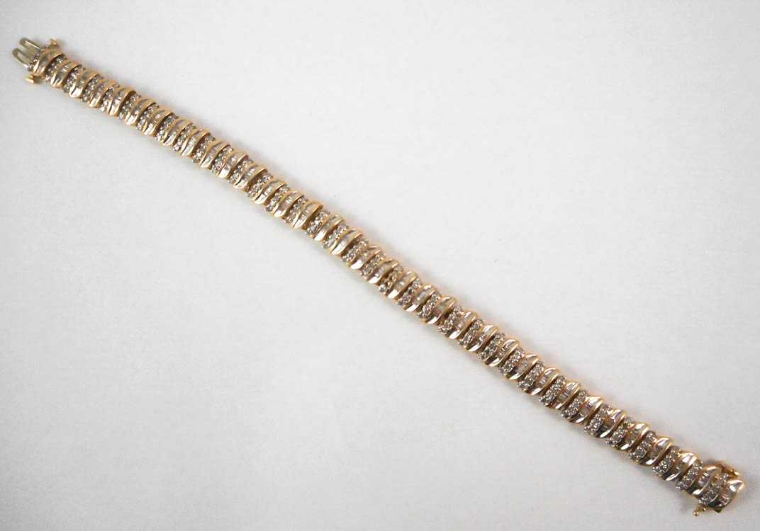 Appraisal: DIAMOND AND TEN KARAT YELLOW GOLD BRACELET measuring - inches