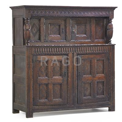 Appraisal: ELIZABETHAN COURT CUPBOARD Two-piece in oak with elaborately carved paneled