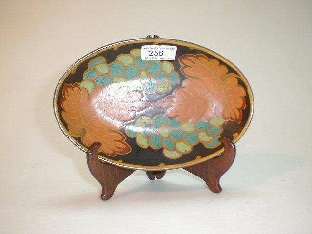 Appraisal: A Gouda pottery oval dish painted with vine leaves and