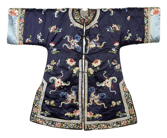 Appraisal: A Chinese sheep-skin lined embroidered robe Of navy silk satin