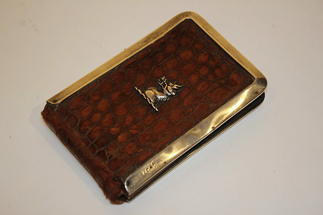 Appraisal: A CROCODILE AND SILVER NOTE CASE by Jenner Knewstub St