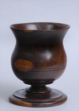 Appraisal: VICTORIAN LIGNUM VITAE TREENWARE URN The shaped bowl with everted