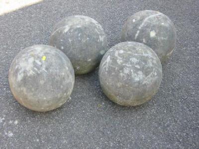 Appraisal: A SET OF FOUR COMPOSITION STONE BALLS high