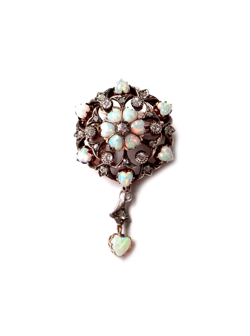 Appraisal: A Victorian opal and diamond set pendant brooch of circular