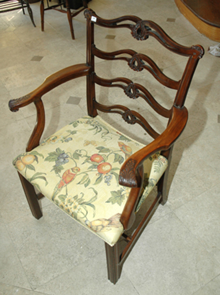 Appraisal: AN EARLY TH CENTURY IRISH MAHOGANY ARMCHAIR The pierced shaped