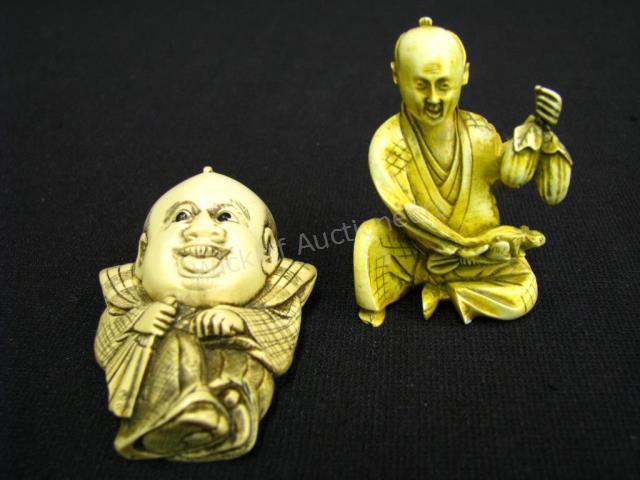 Appraisal: Japanese Carved Bone Figural Netsukes depicting a seated man holding