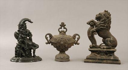 Appraisal: Two Cast-Iron Doorstops Together with a cast-iron urn-form finial to