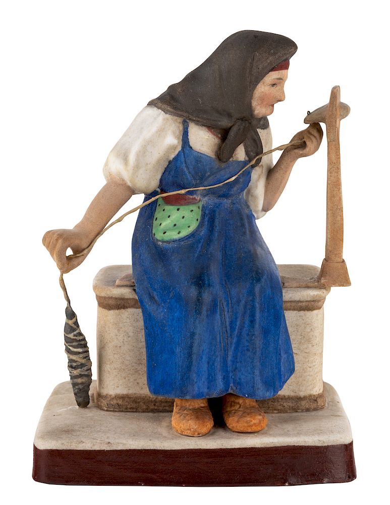 Appraisal: A RUSSIAN PORCELAIN FIGURE OF AN OLD WOMAN CARDING WOOL