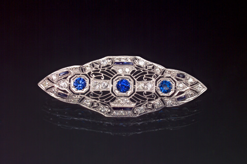 Appraisal: ART DECO Diamond navette brooch with calibr sapphires three blue