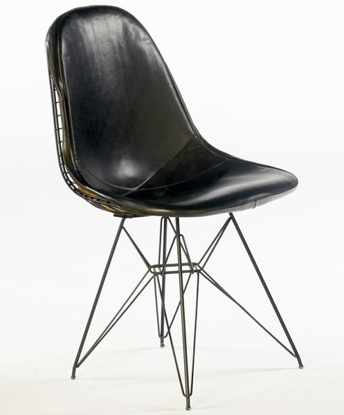 Appraisal: CHARLES RAY EAMES Basket chair with leather seat and Eiffel