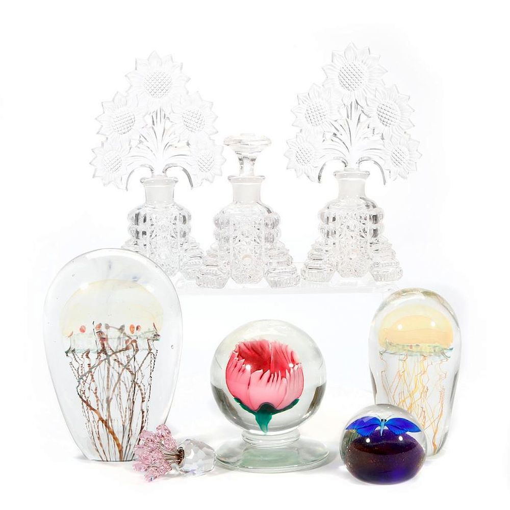 Appraisal: A collection of glass paper weights and perfumes Four Art