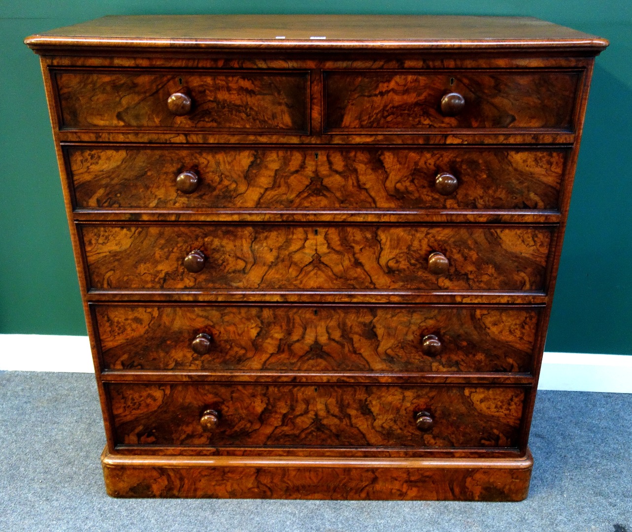 Appraisal: A Victorian burr walnut chest of two short and four