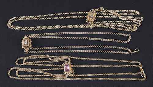 Appraisal: Three Victorian slides on chains two gold-filled one K chain