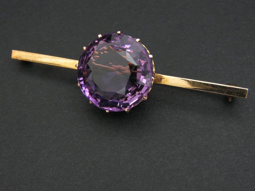 Appraisal: An Amethyst Bar Brooch claw-set large mixed-cut stone in pierced