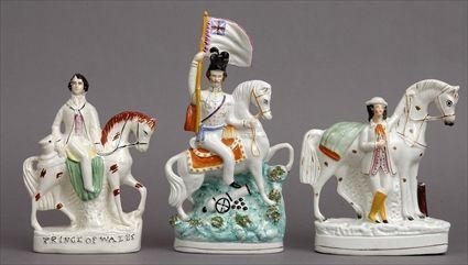 Appraisal: THREE STAFFORDSHIRE EQUESTRIAN FIGURES Variously modeled as a general carrying