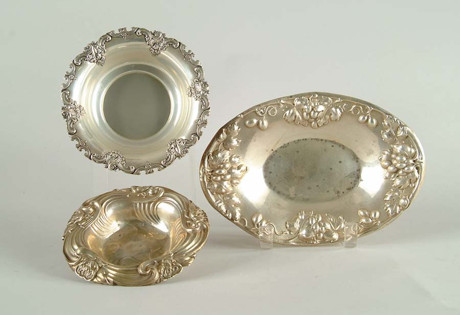 Appraisal: THREE FANCY STERLING DISHES Oval repousse dish - x -