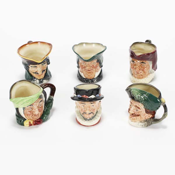 Appraisal: Six small Royal Doulton porcelain Toby mugs cream pitchers Simon