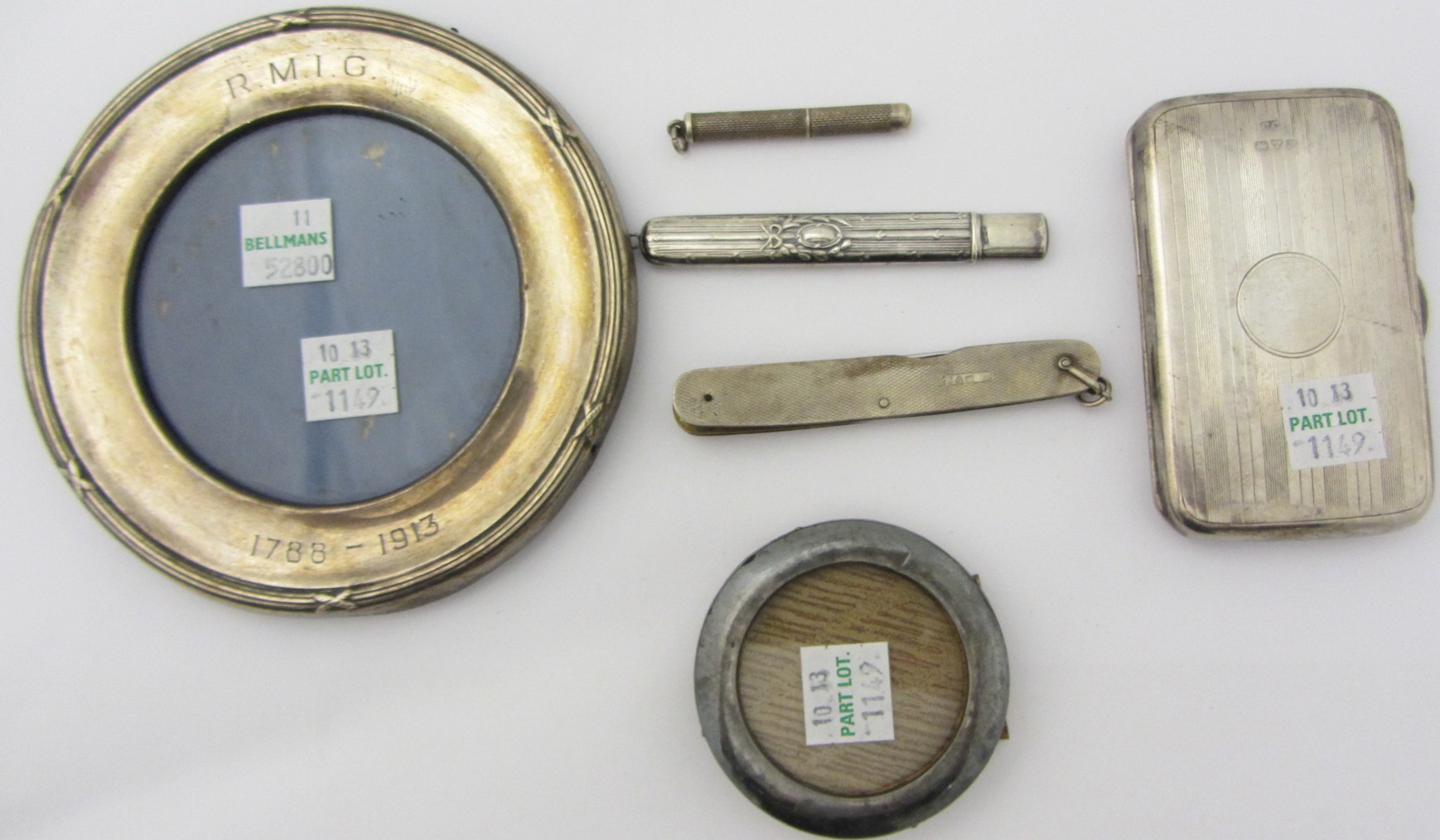 Appraisal: Two silver mounted circular photograph frames a silver rectangular visiting