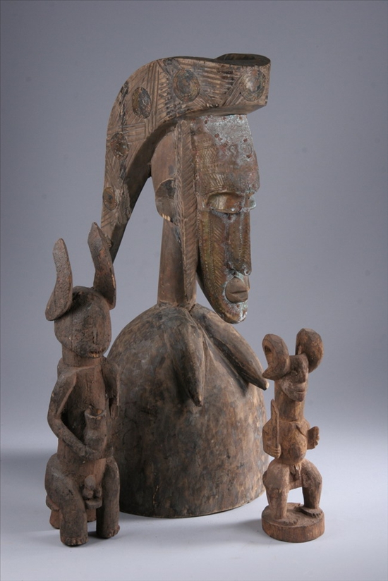 Appraisal: THREE AFRICAN CARVED WOOD FIGURES