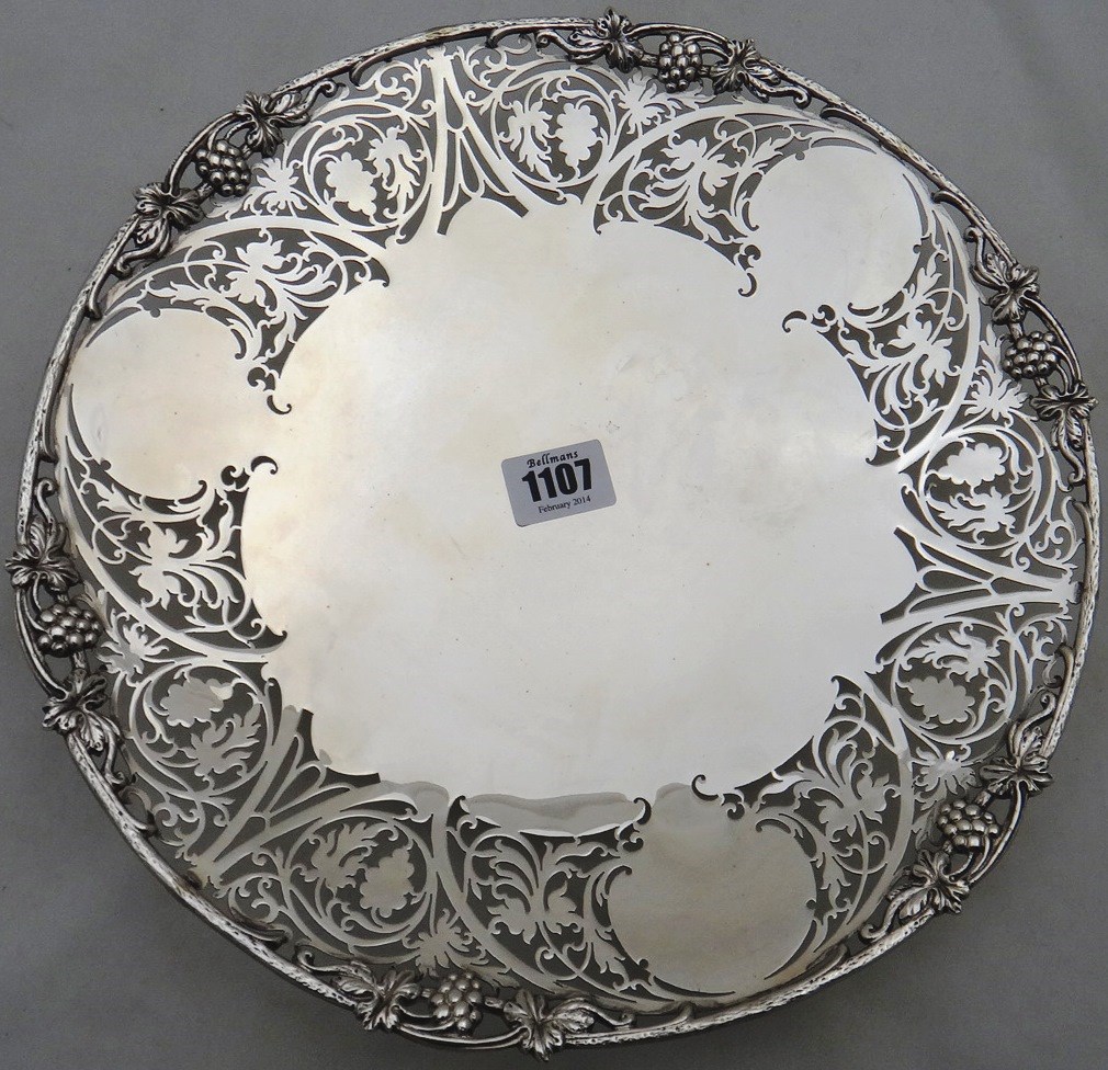 Appraisal: A silver shaped circular centrepiece dish the wide rim cast