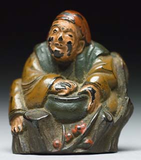 Appraisal: ANTIQUE LACQUERED WOOD NETSUKE Antique lacquered wood netsuke of a