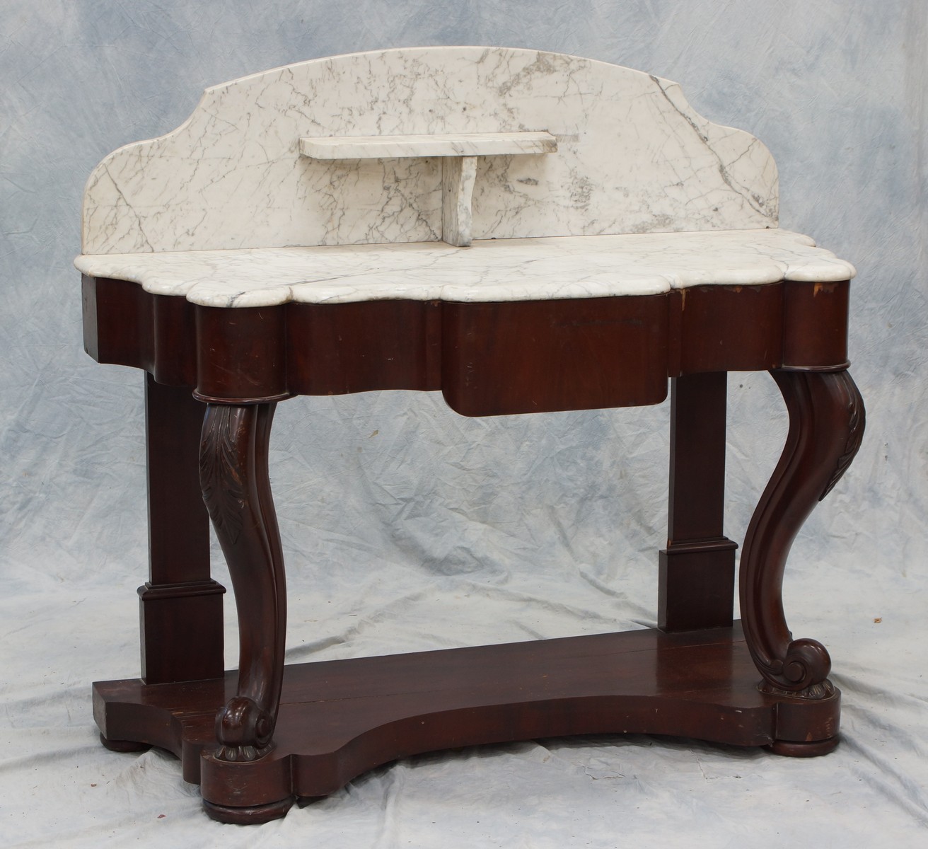 Appraisal: Victorian marble top console table leaf carved knees some veneer