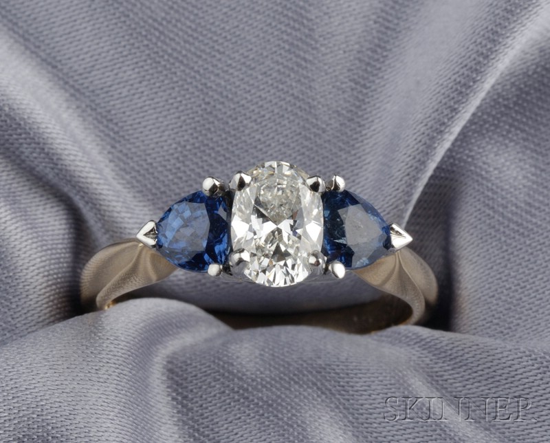 Appraisal: Diamond and Sapphire Three-stone Ring prong-set with an oval-cut diamond